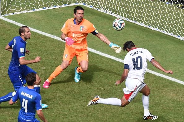 Costa Rica's forward Bryan Ruiz (R) heads the ball to score as Italy's goalkeeper Gianluigi Buffon (2nd R) looks on during a Group D football match between Italy and Costa Rica at the Pernambuco Arena in Recife during the 2014 FIFA World Cup on June 20, 2014. Photo: Getty Images