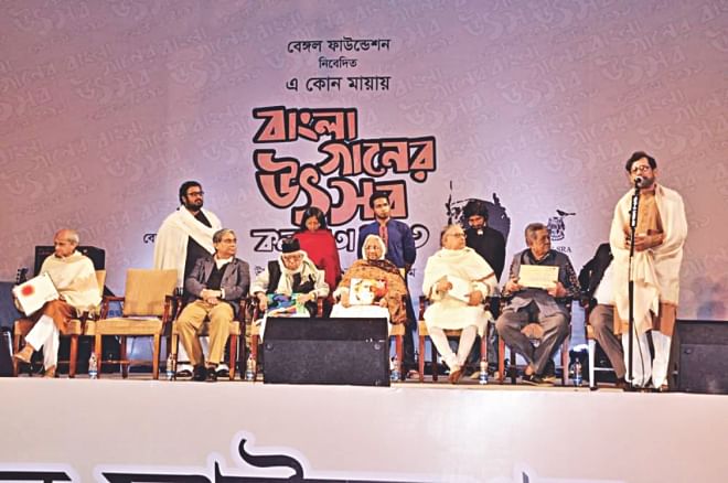 On the lawns of ITC-SRA (the heart of pure classical music in India) a galaxy of artistes, scholars and leading personalities of Bangladesh and India assembled under a huge blue arched canopy resembling an open sky. The occasion marked the first time roster of eminent artistes who had gathered to celebrate the glory of Bangla songs on such a grand scale.