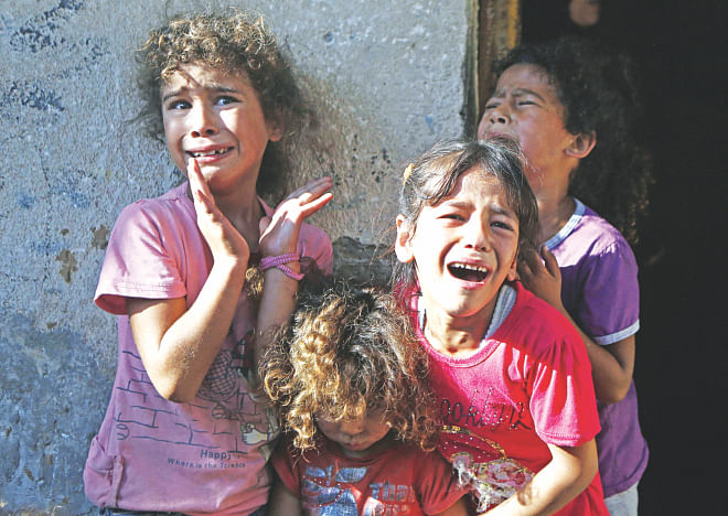 Young relatives of four boys, all from a family, killed during Israeli shelling, cry during their funeral in Gaza City, yesterday. Photo: Star