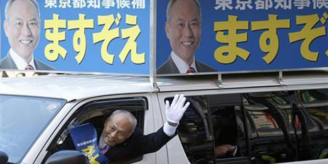 Japan's former health minister and candidate of Tokyo gubernatorial election Yoichi Masuzoe waves to voters from a van, while campaigning for the February 9 vote in Tokyo January 23. Photo: Reuters 