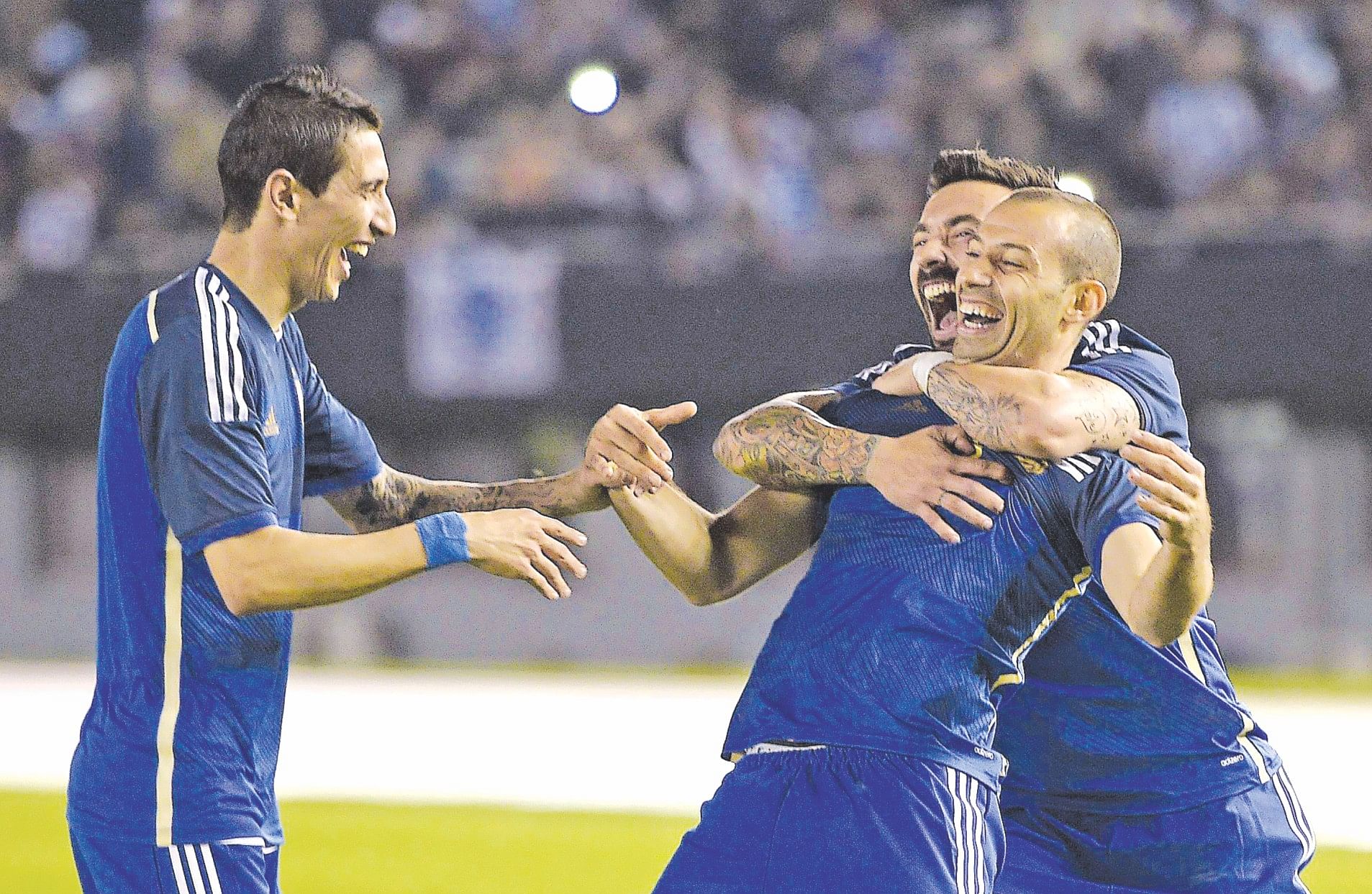  Argentina midfielder Javier Mascherano (C) celebrates his goal with teammates Ezequiel Lavezzi and Angel Di Maria (L) during their international friendly  against Trinidad and Tobago at the Monumental Stadium in Buenos Aires on Wednesday. PHOTO:  AFP