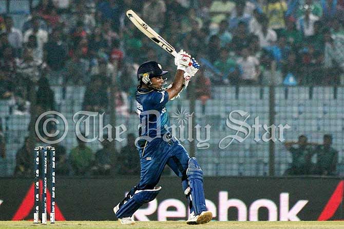 Mahela Jayawardene hits a boundary on his windy blow of 89 runs off 51 balls against England today in a World T20 match at Chittaogng. Photo: Anurup Kanti Das