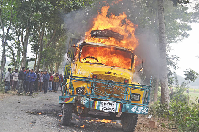 The truck set on fire by the agitating students. Photo: Star