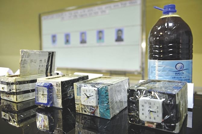 Explosives and bomb-making materials recovered in a raid are on display at the Rab Uttara office in the capital yesterday. Five suspected militants arrested by the elite force were found in possession of four IEDs, 75 electronic detonators, 10kg power gels, 155 circuits, three igniters and one power regulator. Photo: Star