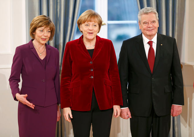 German President Joacham Gauck (R) and his partner Daniela Schadt (L) welcome German Chancellor Angela Merkel, during a New Year reception for public life representatives in the presidential Bellevue Palace in Berlin on Friday. Photo: REUTERS 