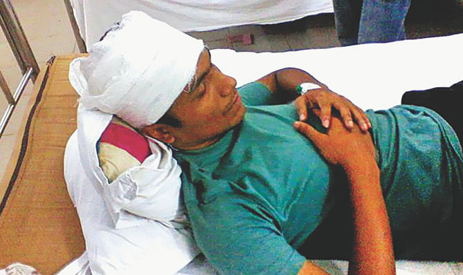 One of the injured Chhatra League activists of Jahangirnagar University's Bhasani Hall in his bed at Enam Medical College and Hospital, Savar, on Thursday. Photo: Star