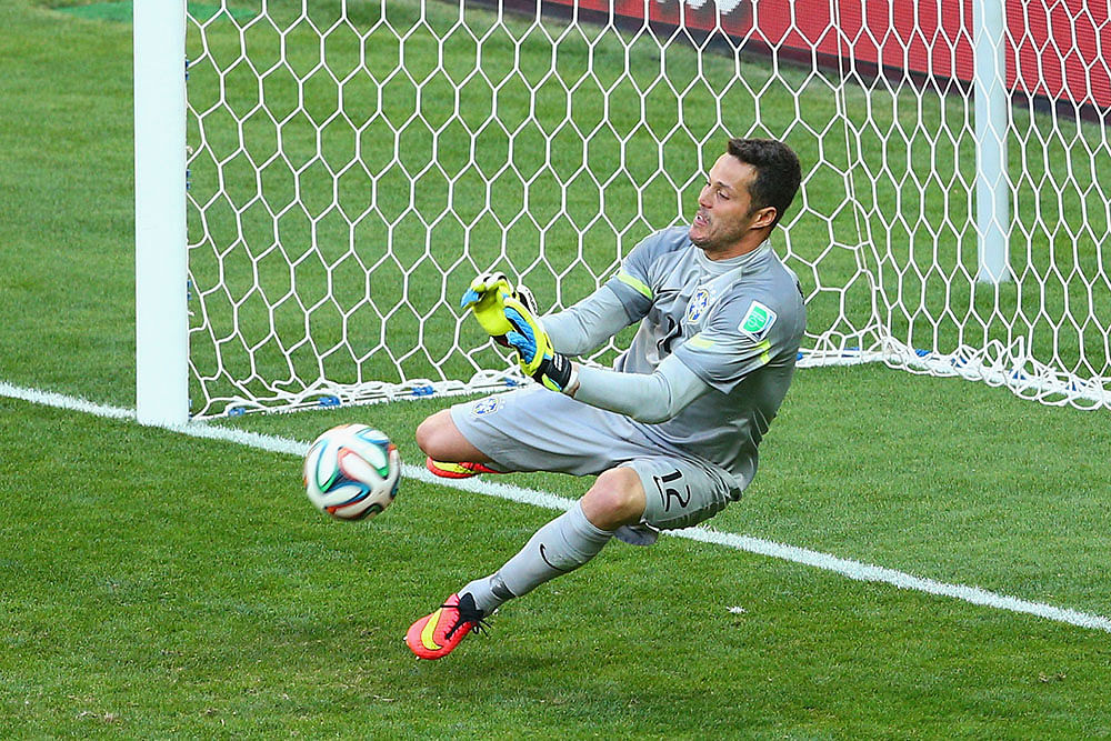 Julio Cesar of Brazil saves a penalty kick from Mauricio Pinilla of Chile (not pictured) during the 2014 FIFA World Cup Brazil round of 16 match between Brazil and Chile on Saturday. Photo: Getty Images 