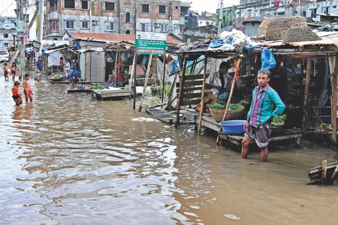 The people of the area have been enduring such waterlogging for several days. In the photo Kajlarpar kitchen market seen inundated. Photo: Anisur Rahman
