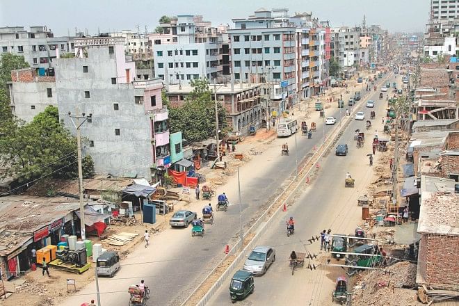 A stretch of the 1.3km Kalshi-Purabi road, which is being widened. With 60 percent of the work done, the rest is likely to be completed by June. The crucial road gives commuters from Airport road an easy access to the capital's Mirpur. The photo was taken yesterday.  Photo: Star
