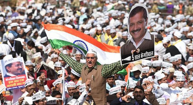 In front of a huge crowd of cheering supporters, Arvind Kejriwal pledged to end Delhi's 