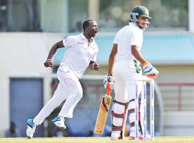 West Indies fast bowler Kemar Roach celebrates the dismissal of Bangladesh's Anamul Haque on the second day of the second and final Test at the Beausejour Cricket Ground in St Lucia on Sunday. PHOTO: WICB