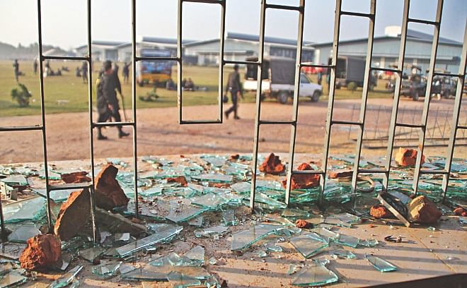 A broken window of Karnaphuli Shoe Industries Ltd at Korean Export Processing Zone in Chittagong. Workers vandalised four of its units and clashed with police over wages yesterday. A worker died and 15 were injured in clashes.  Photo: ANURUP KANTI DAS
