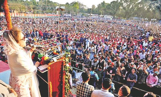 BNP Chairperson Khaleda Zia addresses a 19-party alliance rally on Shaheed Abdul Aziz Khushi Railway Maidan in Rajbari yesterday. This was the BNP chairperson's first public meeting outside the capital since the January 5 general election which was boycotted by the alliance. Photo: Star