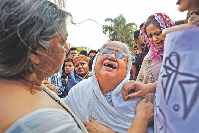 Mother of Sajedul Islam Suman, a ward level BNP leader of Tejgaon and one of the eight victims, wails for her son.  Photo: Rashed Shumon