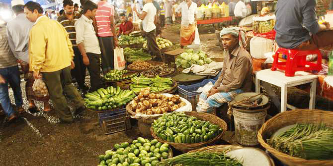 People are seen buying vegetables at Karwan Bazar kitchen market in the capital on October 27, 2013. Photo: STAR