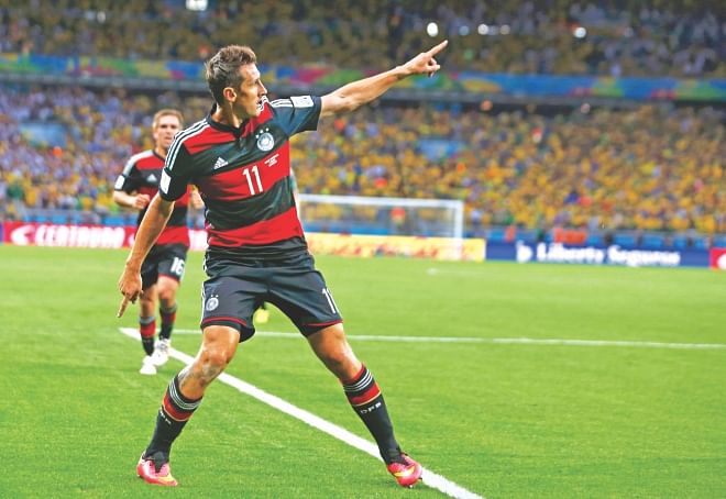 World Cup's number one ... Germany's Miroslav Klose celebrates after striking his World Cup record-setting 16th goal, and his side's second, in a record 7-1 win over Brazil in the first semifinal at the Estadio Mineirao in Belo Horizonte on Tuesday. PHOTO: REUTERS