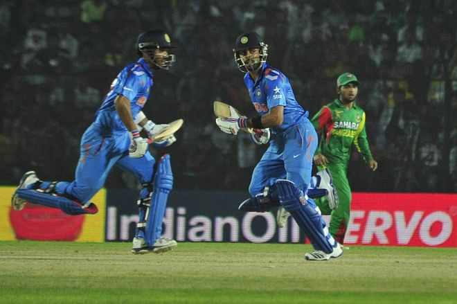India captain Virat Kohli (C) led his side from the front as did Mushfiqur Rahim for Bangladesh in their Asia Cup opener at Fatullah yesterday. However, Kohli's 136 overshadowed Mushfiqur's 117 as India cruised to a six-wicket win. Photo: Firoz Ahmed