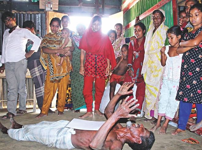 The elderly father of Shah Alam, one of the Bangladeshi workers killed in a furniture factory fire in Riyadh, wails at their village home in Kalipur of Comilla yesterday. Photo: Banglar Chokh
