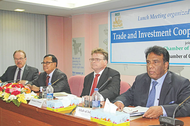 From left, Dan Mozena, US ambassador; Shahjahan Khan, president of DCCI; Michael Delaney, US assistant trade representative, and Aftab ul-Islam, president of AmCham, attend a discussion on Ticfa, in Dhaka yesterday. Photo: Star 