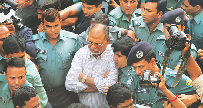 Abdul Latif Siddique being escorted to a Dhaka court around 40 minutes after his surrender at Dhanmondi Police Station yesterday. The controversial former minister was sent to jail with a number of cases filed against him on charges of hurting religious sentiments. Photo: Amran Hossain