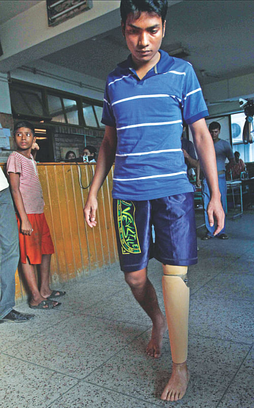 Limon trying out a prosthetic leg, later that year. Photo: File