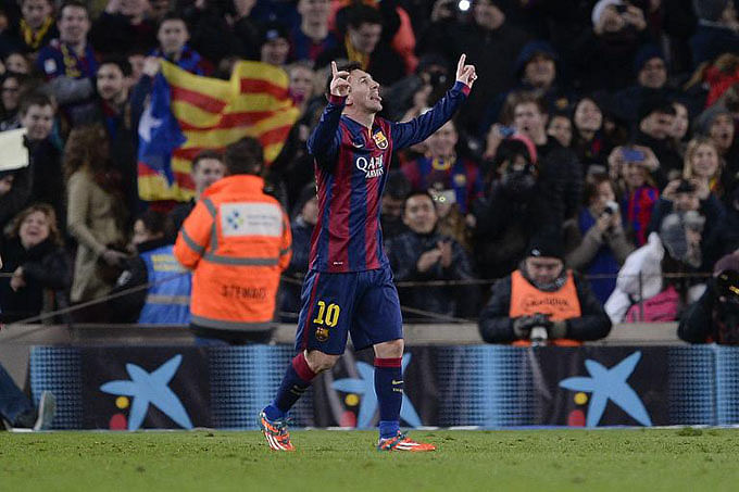 Barcelona's Argentinian forward Lionel Messi celebrates his goal during the Spanish Copa del Rey quarter final first leg football match FC Barcelona vs Club Atletico de Madrid in Barcelona on January 21, 2015. Photo: AFP