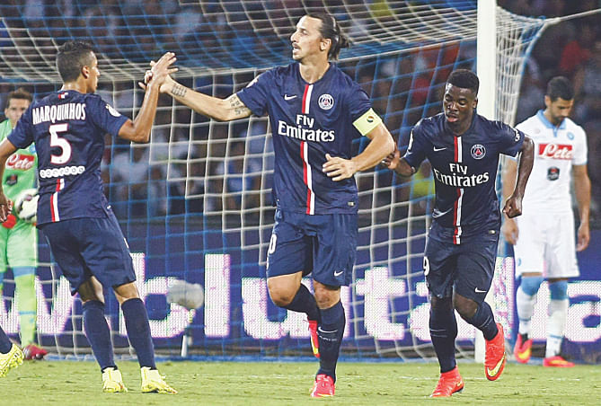 Paris Saint-Germain star Zlatan Ibrahimovic (C) celebrates his goal with teammate Marquinhos (L) during their friendly match against Napoli in Naples on Monday. Photo: AFP