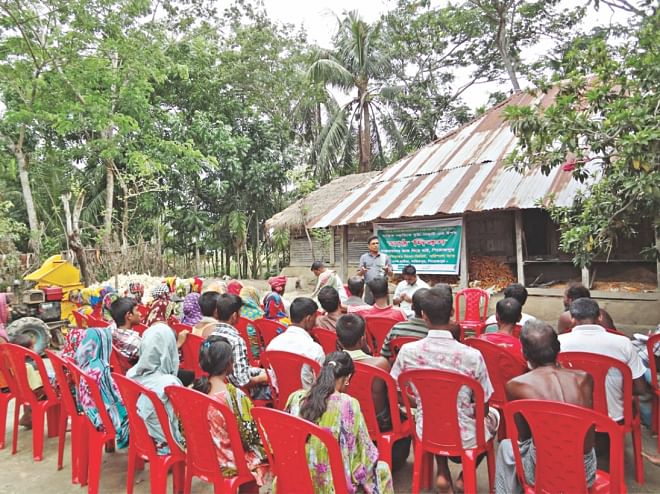 Farmers of Raghunathpur village of Nazirpur upazila attending 'Math Dibosh' event organized by 'Dak Diye Jai'. PHOTO: STAR