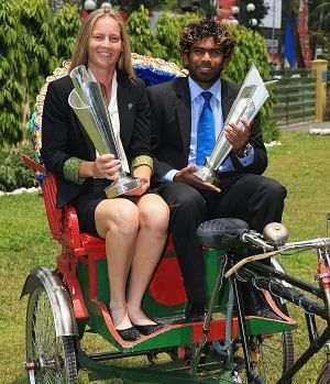 Australia women's team captain Meg Lanning and Sri Lanka skipper Lasith Malinga pose with the ICC World Twenty20 trophies during a function at a city hotel yesterday. PHOTO: CRICINFO
