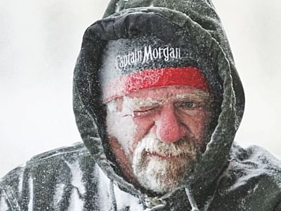 A man braves the bitter cold. Photo: AFP