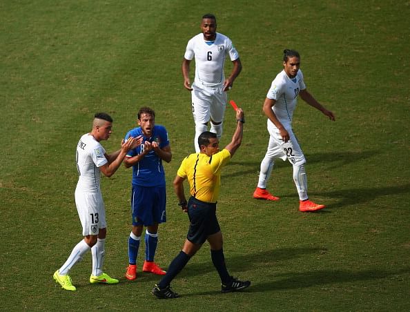 Referee Marco Rodriguez shows a red card to Claudio Marchisio of Italy during their 2014 FIFA World Cup Brazil Group D match against Uruguay at Estadio das Dunas on June 24, 2014 in Natal, Brazil. Photo: Getty Images