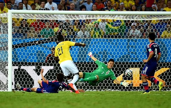 Jackson Martinez of Colombia scores his team's second goal past Eiji Kawashima of Japan during the 2014 FIFA World Cup Brazil Group C match between Japan and Colombia at Arena Pantanal on June 24, 2014 in Cuiaba, Brazil. Photo: Getty Images