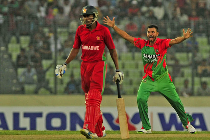 The third ODI in Mirpur was almost a replay of the second in Chittagong. After the Tigers had thrived on a century partnership between openers Anamul Haque and Tamim Iqbal to post a massive total, captain Mashrafe Bin Mortaza (R) made sure the Zimbabwe innings doesn't take off with two early blows. Photo: Firoz Ahmed 