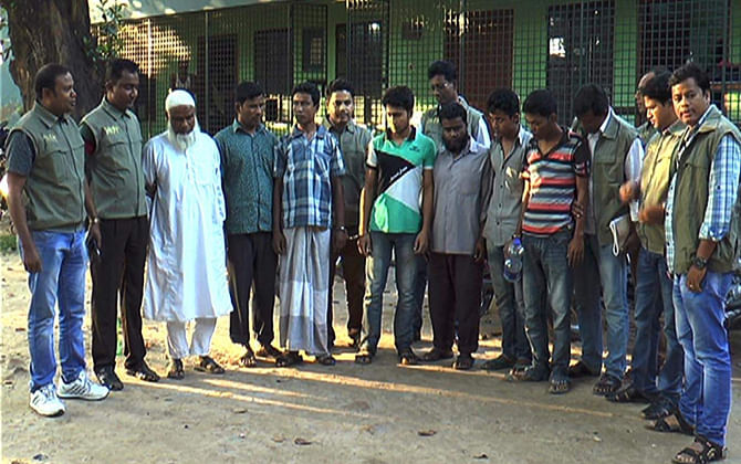 Law enforcers with the six people arrested on charge of stealing medicines from Dinajpur Medical College Hospital yesterday.  PHOTO: STAR