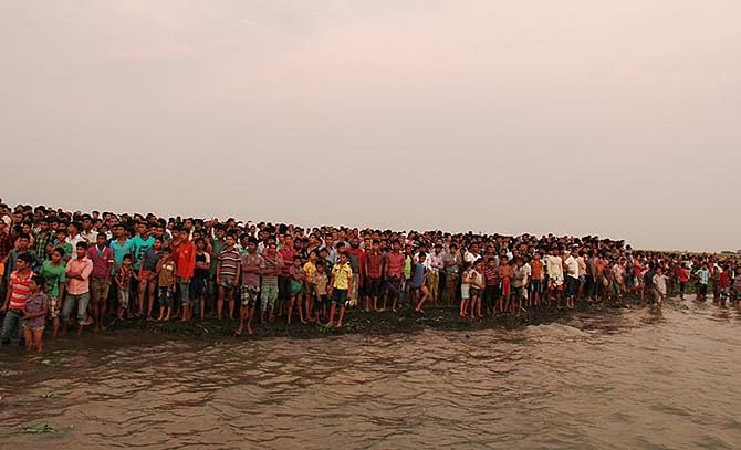 People were waiting on the river bank after a Sureshwar-bound launch from Dhaka capsized in Meghna near Dhaulatpur in Munshiganj with over 200 passengers Thursday afternoon. 