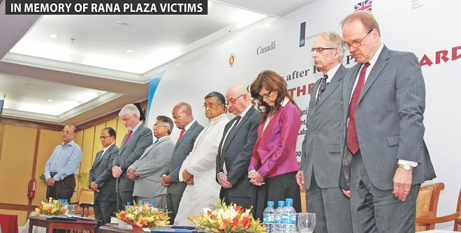 Fifth from right, Khandker Mosharraf Hossain, expatriate welfare and overseas employment minister, and foreign diplomats observe moments of silence in memory of Rana Plaza workers, at a programme at Ruposhi Bangla Hotel in Dhaka yesterday.  Photo: Star 