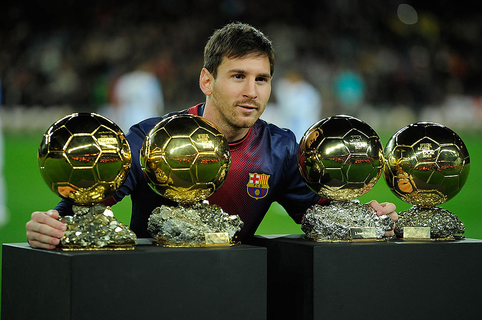 Leo Messi of Barcelona FC displays his four ballons d'or to the audience prior to the Copa del Rey Quarter Final match between Barcelona FC and Malaga CF at Camp Nou on January 16, 2013 in Barcelona, Spain. Photo: Getty Images