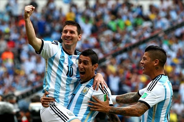 Lionel Messi (L) of Argentina celebrates scoring his goal with his teammates Angel di Maria (C) and Marcos Rojo (R) during the 2014 FIFA World Cup Brazil Group F match between Nigeria and Argentina at Estadio Beira-Rio on June 25, 2014 in Porto Alegre, Brazil. Photo: Getty Images