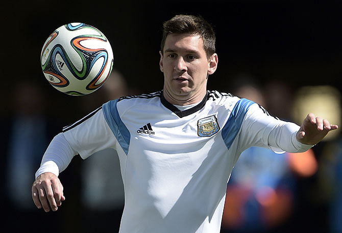 Argentina's Lionel Messi controls the ball during the official training session at The Corinthians Arena in Sao Paulo ahead of their 2014 FIFA World Cup Brazil round of 16 football match against Switzerland. Photo: Getty Images