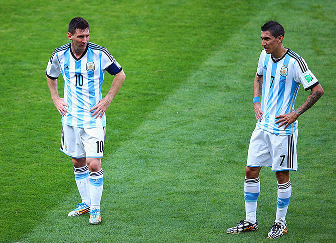 Argentina's forward and captain Lionel Messi (L) and Argentina's midfielder Angel Di Maria celebrate after scoring the 1-0 during of a Round of 16 football match between Argentina and Switzerland at Corinthians Arena in Sao Paulo during the 2014 FIFA World Cup on July 1, 2014. AFP PHOTO / NELSON ALMEIDA. Photo: Getty Images