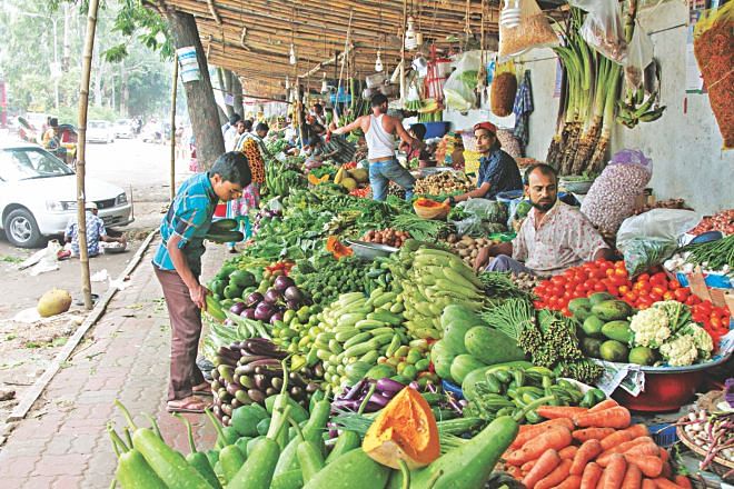 This file photo shows a kitchen run illegally on the footpath of Jasim Uddin Road at the capital’s Uttara Sector-1. The market stretching around 150 metres on the road’s southern side keep coming back on the footpath despite being removed many times. Photo: Star