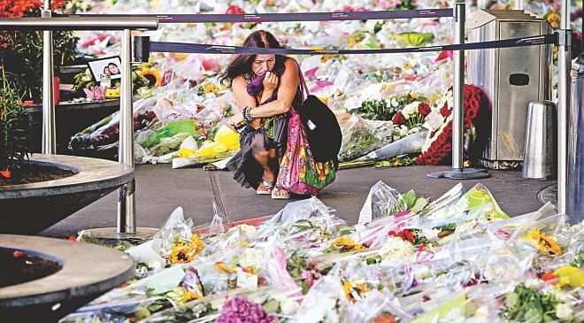 A Dutch woman mourns the victims of the plane crash. The first bodies from flight MH17 arrived in the Netherlands yesterday almost a week after it was shot down over Ukraine killing 298 people on board.  Photo: AFP