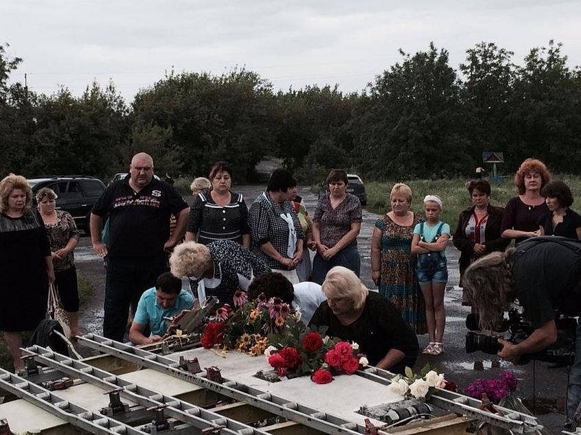 Local residents mourning the dead from MH17, which fell down on their village. Photo: BBC