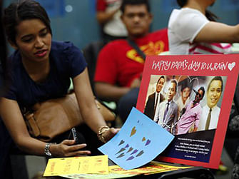 Relatives of Malaysian passengers on board the missing Malaysia Airlines Flight 370 looks at a picture of missing crew during an event to commemorate the 100th day after the flight went missing, in Kuala Lumpur, on June 15. Photo: AP