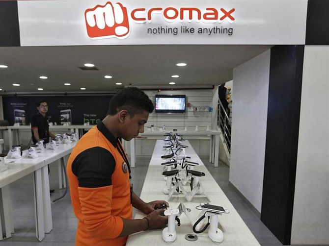 An employee checks Micromax mobile phones at a showroom in New Delhi. Photo: REUTERS/FILE 