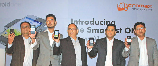 Third from left, Amit Mathur, international business head of Micromax, poses with a Canvas A1 smartphone at the local launch of the handset at a programme in Dhaka yesterday.   Photo: MicromaX 