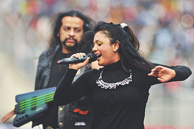 Popular singer Mila Islam enthrals the packed crowd at the Sylhet District Stadium during the opening ceremony of the Bangabandhu Gold Cup yesterday. PHOTO: STAR