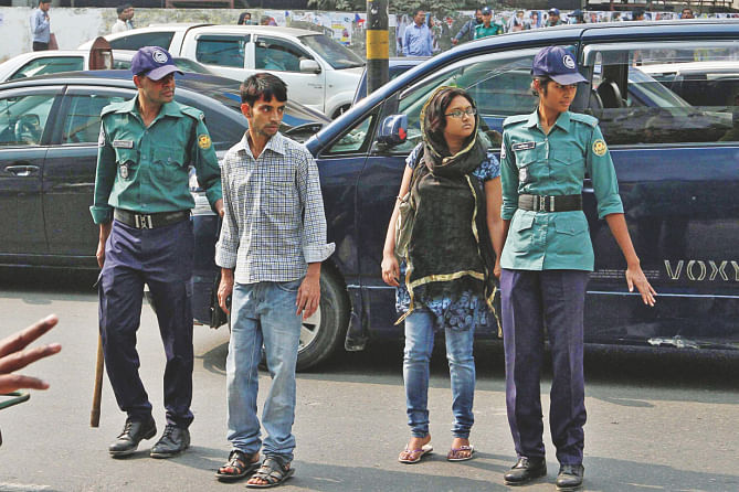 Cops find two pedestrians jaywalking at Banglamotor. Photo: Anisur Rahman