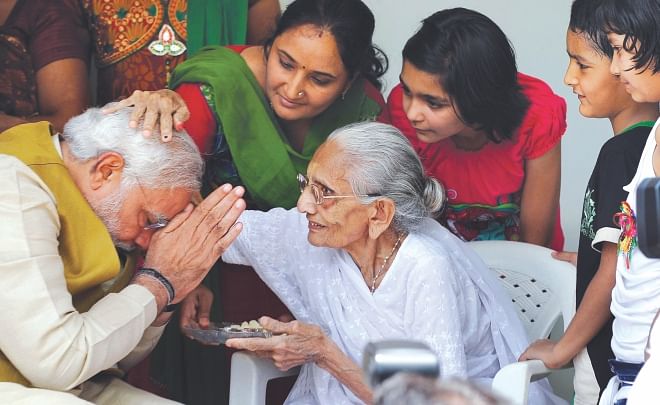 This STAR file photo shows Narendra Modi takes blessings from his mother before the Lok Shava polls