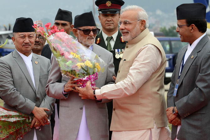 Second from left front row, Nepalese Prime Minister Sushil Koirala welcomes Indian Prime Minister Narendra Modi on his arrival at Tribhuvan International Airport in Kathmandu yesterday. Photo: AFP